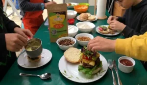 family cooking edible insect burger Family cooking an edible insect burger